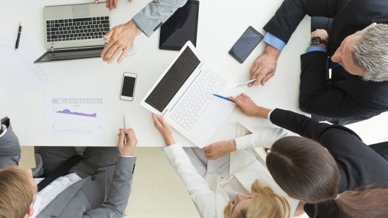 Business people team at meeting working with charts and laptop